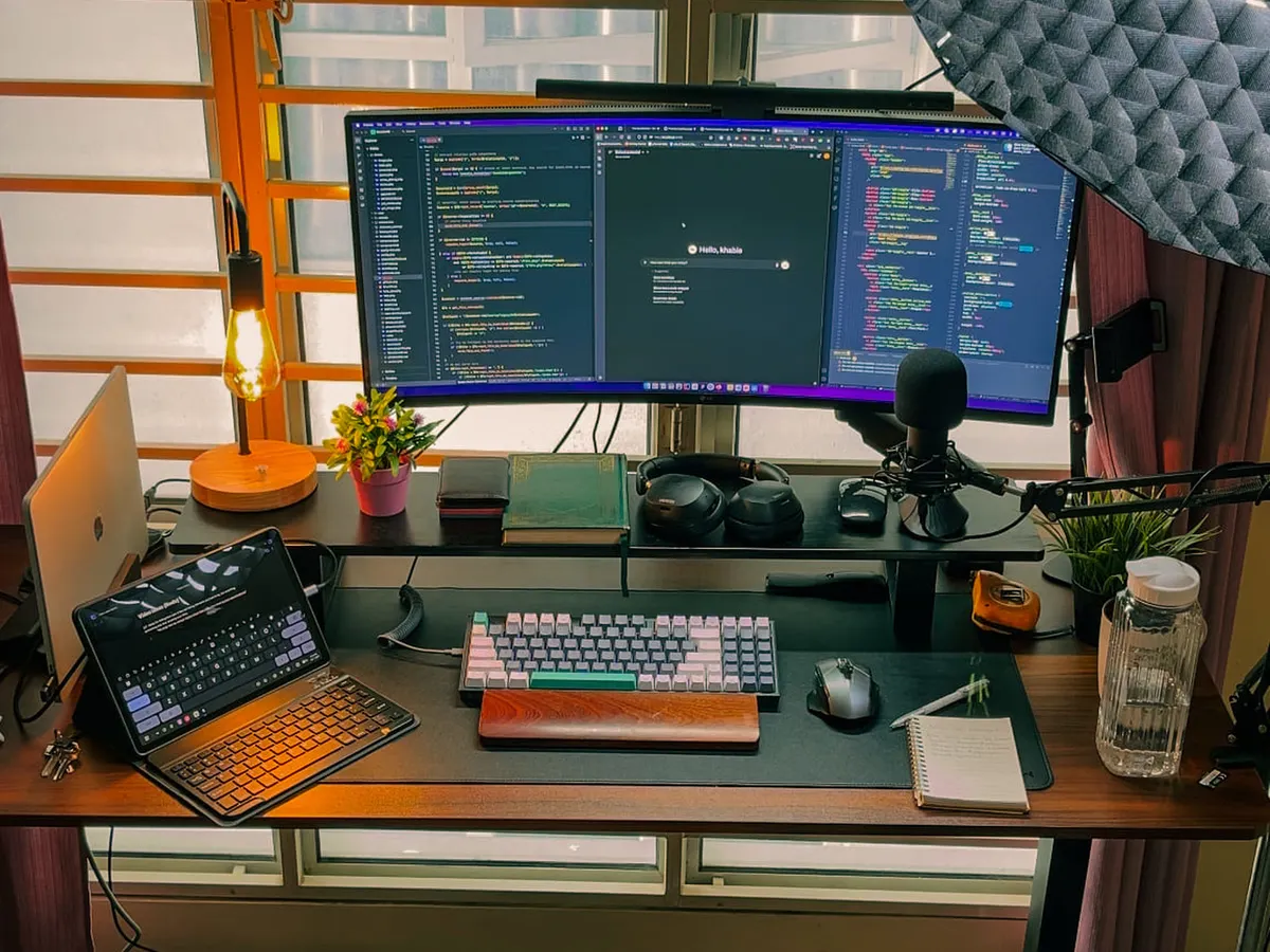 Developer workstation with code open across dual monitors